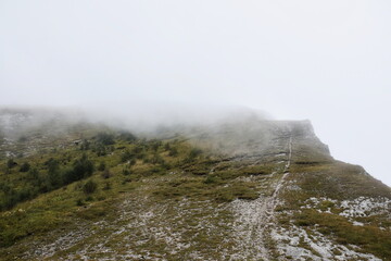 Hiking along a steep slope to a mountain peak