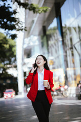 Asian businesswoman using a digital tablet working in the city