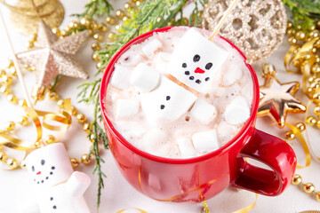 Christmas hot chocolate with funny snowman made with marshmallows