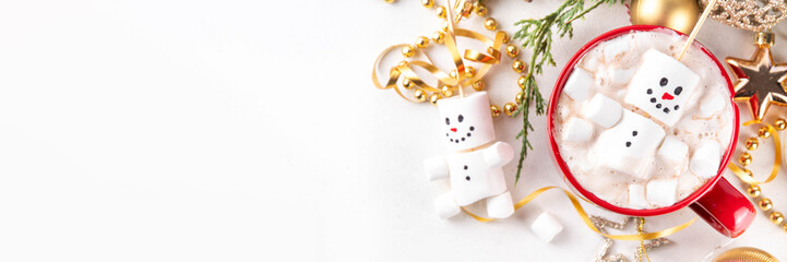 Christmas hot chocolate with funny snowman made with marshmallows
