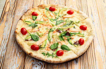 Italian pizza with avocado salmon  tomatoes and mozzarella photography. top view