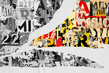 Collage of many numbers and letters ripped torn advertisement street posters grunge creased...