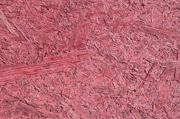 Rough slatted board painted in burgundy color closeup