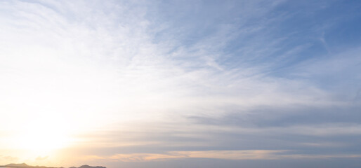 Beautiful morning or evening blue and orange sky while sunsets or sunrises taken at the sea used as natural blackground texture