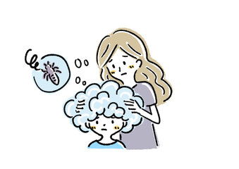 アタマジラミの除去をする親子