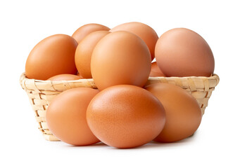 Group of fresh brown chicken eggs in stack in wicker basket isolated on white background with clipping path