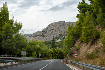 Mountain road in the Dalmatia region, Croatia, winding through scenic landscapes with breathtaking...