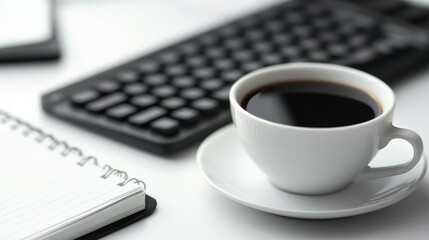 Black coffee in a white cup on a clean desk with a notepad and a keyboard, symbolizing productivity, focus, and work ethic during a busy day or a brainstorming session.