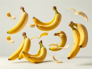 Various falling fresh ripe banana on light white background, horizontal composition