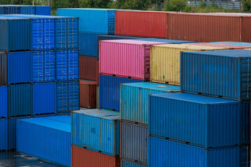 Close up view of shipping containers at railway terminal.