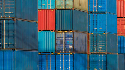 Close up view of shipping containers at railway terminal.