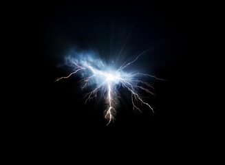 Fototapeta premium A bright blue and white energy burst in the shape of a butterfly against a dark background.