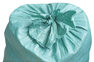 Closed plastic bag . A large green plastic bag tied tightly. It's filled with something and tied tightly at the top.  