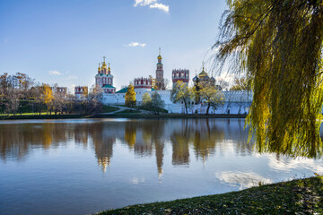 View of the Theotokos-Smolensky Novodevichy Convent of the 16th century in Moscow on an autumn sunny day from the side of Novodevichy Pond
