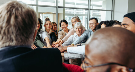 Diverse business team working together to achieve successful performance