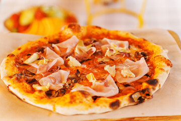 Mini pizza with ham. Convenient pizza size for a quick snack.