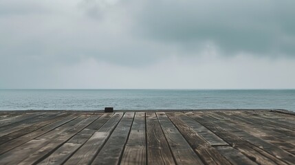 Calm sea horizon view from a weathered wooden platform, evoking tranquility