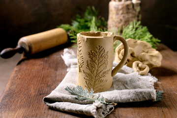 Decorating of raw clay ceramics