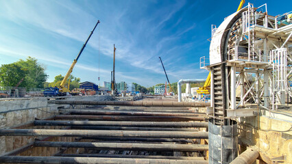 Huge ditch pit at the construction site of the underground metro station line timelapse.
