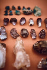 Aura, spiritual and gemstones with crystals in studio for holistic healing, aesthetic and reiki energy. Amethyst, rock minerals and chakra with jewels on background for balance, peace and geology