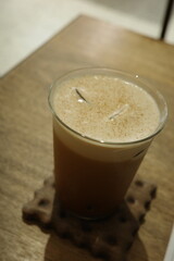 Close-up of a cup of fragrant and rich iced American coffee
