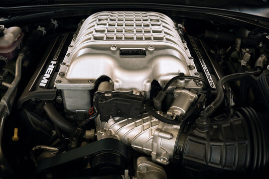 Supercharged HEMI engine of a car, high power and performance, robust design and well-crafted mechanical components.