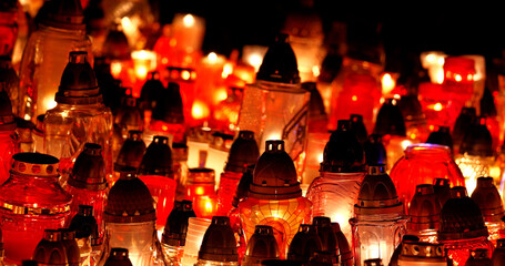 All Saints' Day candles in the evening in a cemetery