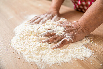 Chef preparing dough - cooking process. Bakers hand. Hands baker with flour in kitchen. Hands woman covered in flours. Women's hands, flour and dough