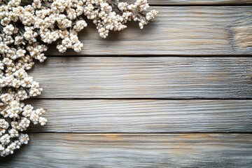 A close-up of dried flowers on a wooden surface, creating a natural and rustic aesthetic.