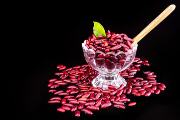 red kidney beans in bowl on black