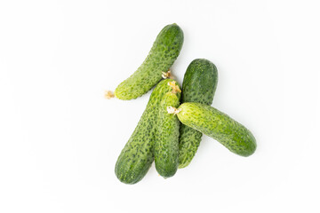 Top view of green fresh cucumbers on a white background