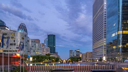 Obraz premium Paris cityscape with modern buildings in business district La Defense day to night timelapse. Paris, France