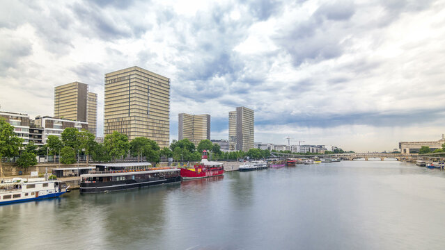 National Library of France timelapse hyperlapse, whose four buildings in the form of open books surround a wooded area.
