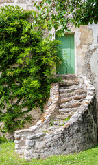 old stone stairs to the entrance door