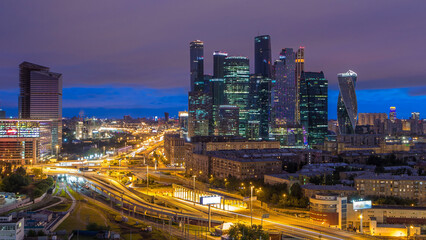 Fototapeta premium Night to day view of the city traffic timelapse and Building of Moscow International Business Center Moscow-City