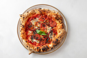  spicy red Italian pizza with tomato, mozzarella fiordilatte, parmesan, pepperonioli and olive powder, isolated on white background.