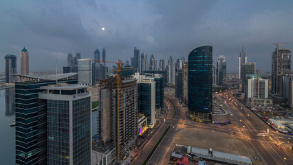 Dubai Downtown night to day timelapse. Aerial view over big futuristic city by night.