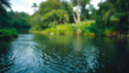 Blurred image of a lake or river surrounded by lush vegetation and trees, creating a sense of depth and mystery, serene, peacefulness