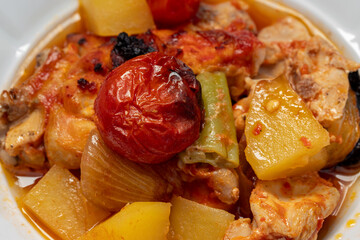 Traditional delicious Turkish dishes; potato, tomato, pepper, garlic and meat dish (Turkish name; Fırında tas kebabı,)