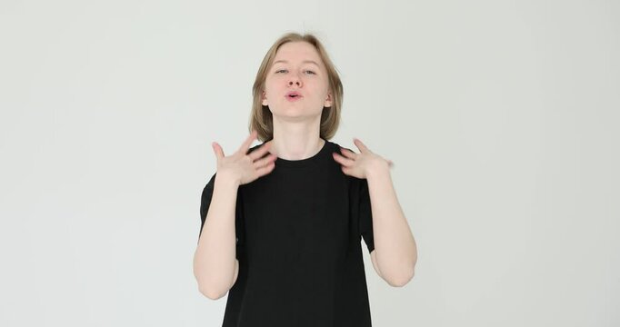 Tired young woman feeling overheated, suffering from heatstroke against white background