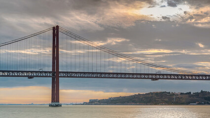 Lisbon city sunrise with April 25 bridge timelapse