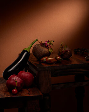 Fresh organic fruits and vegetables on dark wooden table