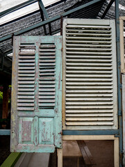 Two old windows are used as room decoration with a vintage theme