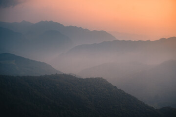 Fototapeta premium Mountains from above, mountains overlapping with morning fog