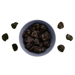 dried plums black bowl blue dried fruits