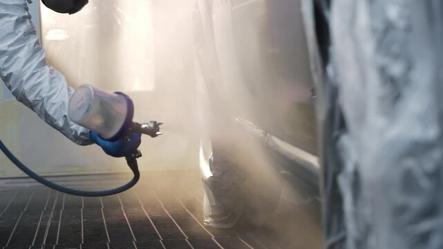 Man Painting Car in Spray Booth - 4K - Close Up - Car, Vehicle, Painting, Spray Gun, Garage, Workshop, Repair, Maintenance, Service, Industry, Automotive