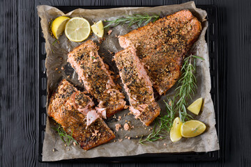 baked salmon fillet on baking tray, top view