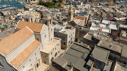 Fototapeta premium Aerial view of the Cathedral of Bisceglie, in Puglia, Italy. The Romanesque church of Saint Peter Apostle is located in the historic center of the town.