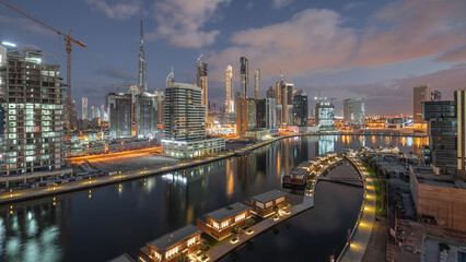 Obraz premium The rhythm of the city of Dubai from night to morning aerial timelapse