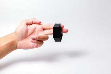 Male hand holding smart watch on isolated background